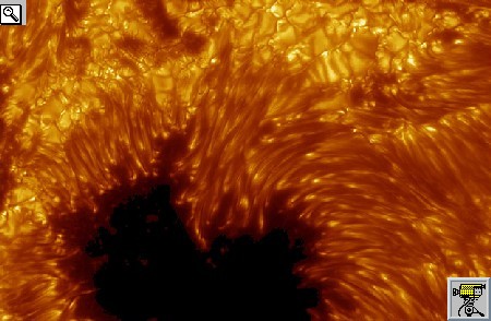 Foto e filmato dello Swedish Solar Telescope del bordo di una macchia solare; vi sono visibili i granuli fotosferici e le spicole